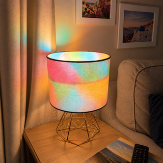 Mosaic glow bulb illuminating a bedside lamp — ST64