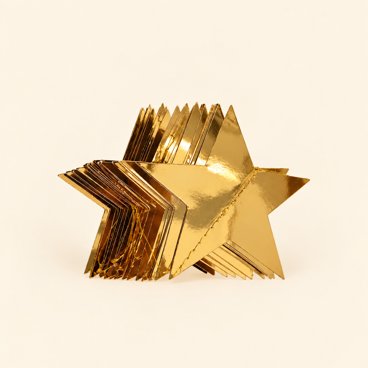 Gold star garland hanging over mirror