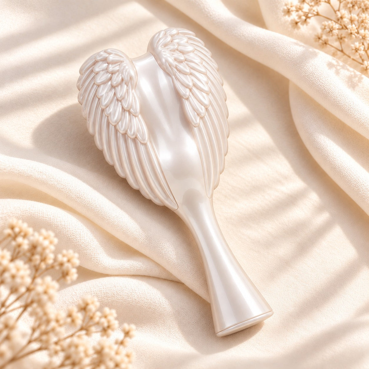 White Angel Hairbrush with pearly sculpted angel wings on cream silk
